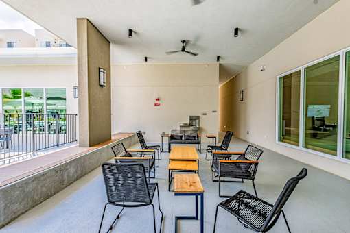 A patio with a table and chairs is shown.