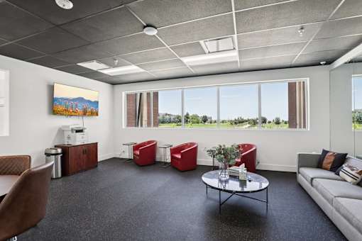 A modern office space with a view of the outdoors.