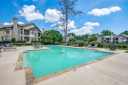 the preserve at ballantyne commons pool with apartment buildings