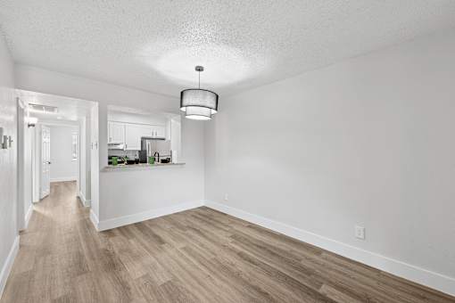 A room with a light brown floor and a white ceiling.