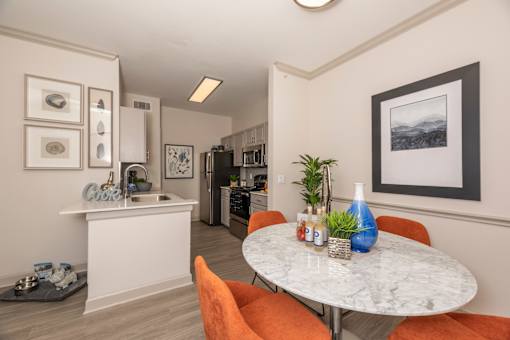 Kitchen with a white island at Woodbridge Villas Apartments, Sachse