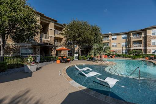 Lounging By The Pool at Woodbridge Villas Apartments, Texas, 75048