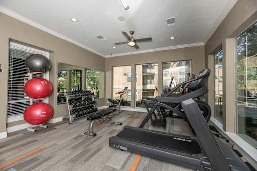 Well-equipped home gym at Woodbridge Villas Apartments, Sachse, Texas