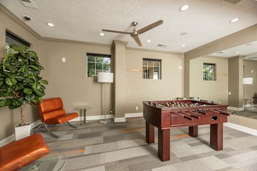 Clubroom with a foosball table at Woodbridge Villas Apartments, Sachse