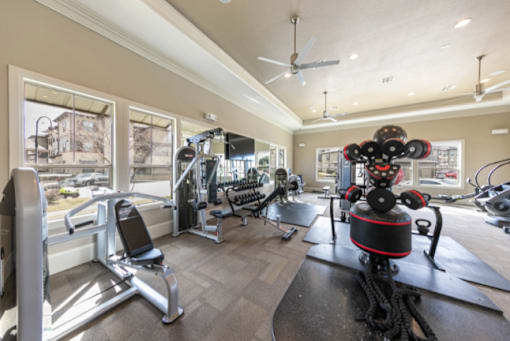 A well-equipped gym with a variety of exercise machines.