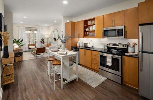 A modern kitchen with wooden cabinets and a white island.
