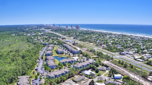 A bird's eye view of a residential area with a road running through it.