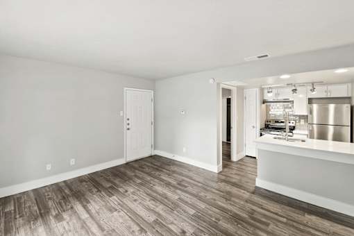 A kitchen area with a counter and stove top oven.