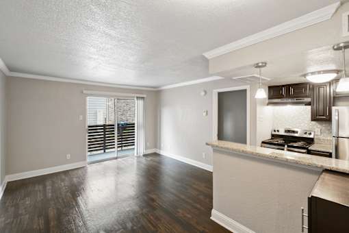 A kitchen with a counter and a microwave.