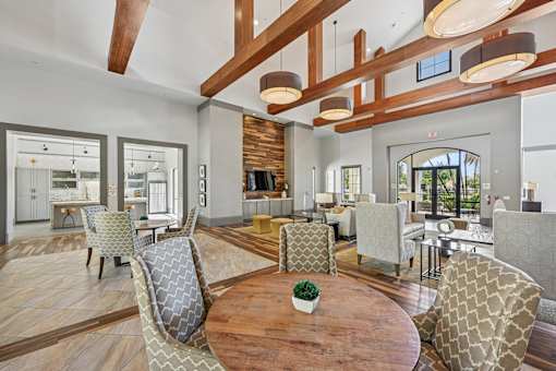 A modern living room with wooden floors and furniture.