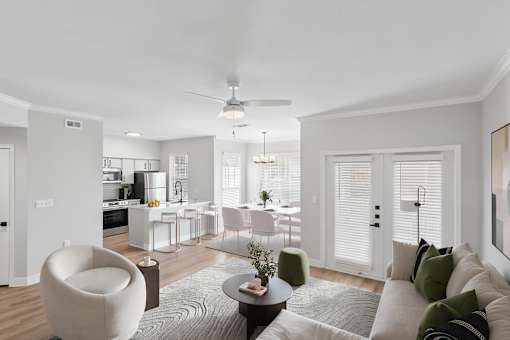A modern living room with a grey sofa and a round chair.