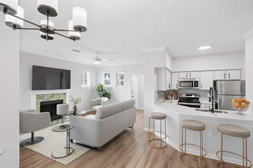 A modern living room with a fireplace and a bar area.