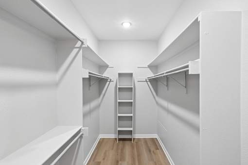 A white room with a ladder in the middle of it.