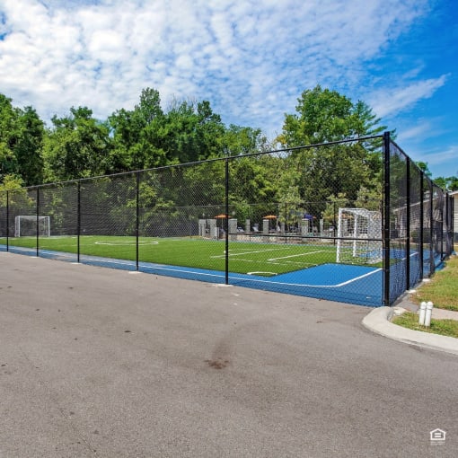 a basketball court and soccer field at the preserve at great pond apartments in windsor locks,