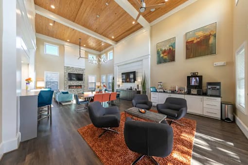 A living room with a black chair in the middle of the room.