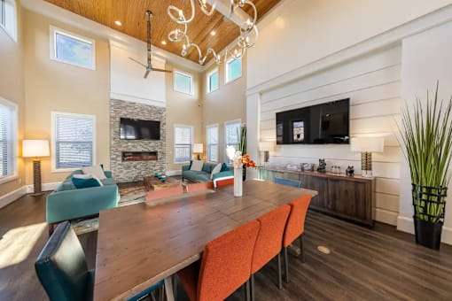 A modern living room with a wooden table and chairs.