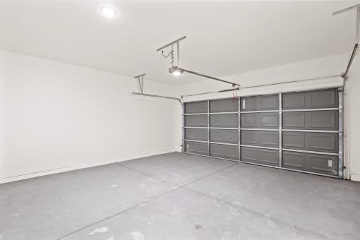 the interior of a garage with a metal door