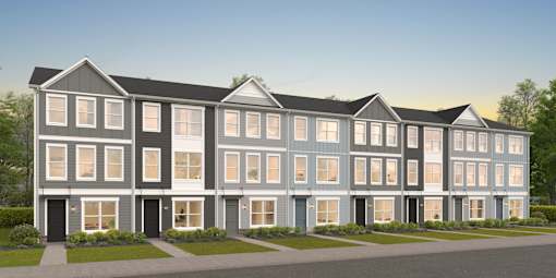 A modern two-story building with a combination of grey and white exterior.