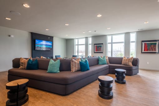 a living room filled with furniture and a flat screen tv