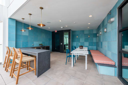 a seating area with a table and chairs