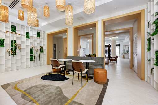 A modern dining area with a round table and chairs.