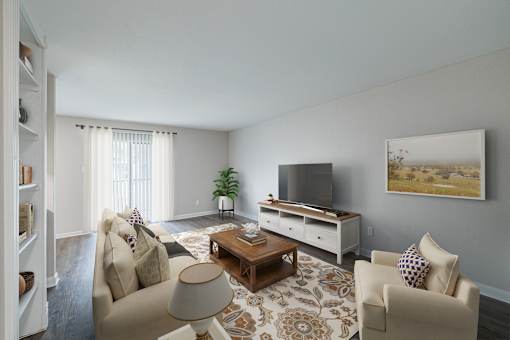 A living room with a couch, chair, and television.