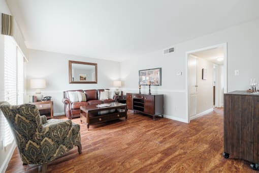 a living room with a couch and a chair