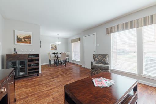 a view of the living room from the dining room and kitchen of an apartment