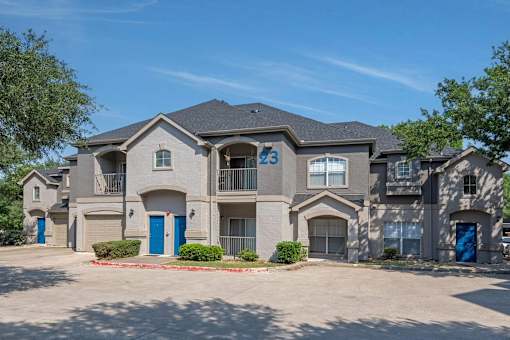 A large, modern house with the number 23 on the front.