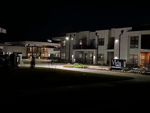 the building where the hotel is located is lit up at night