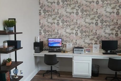 a white desk with a computer on it