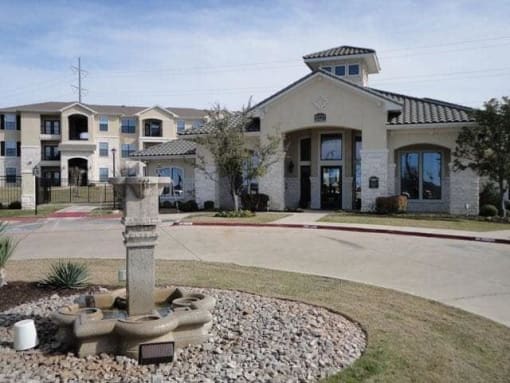 a water fountain in front of a building