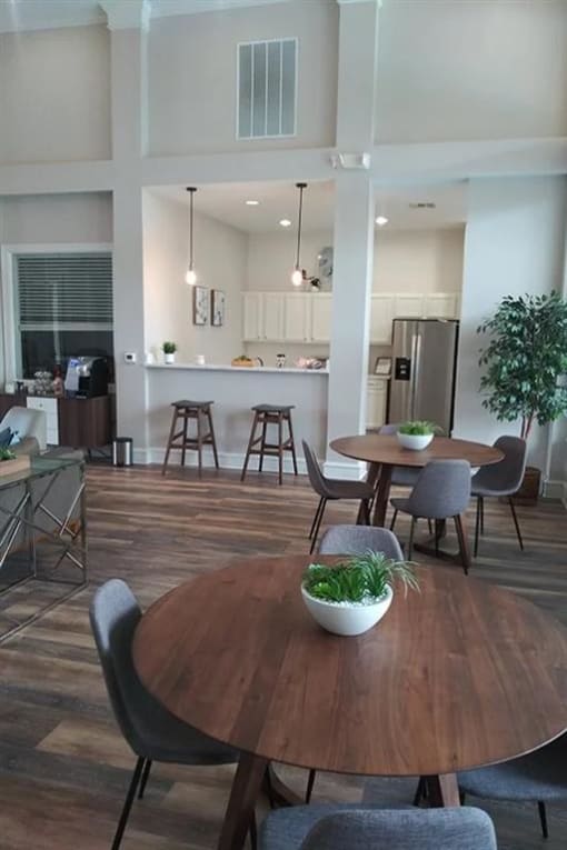 a kitchen and dining room with a table and chairs