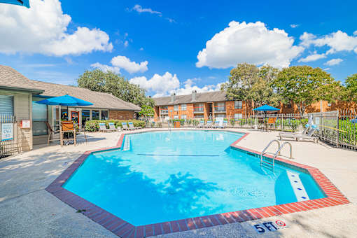 A large swimming pool with a red and blue border.