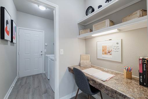 A small home office with a desk and chair.
