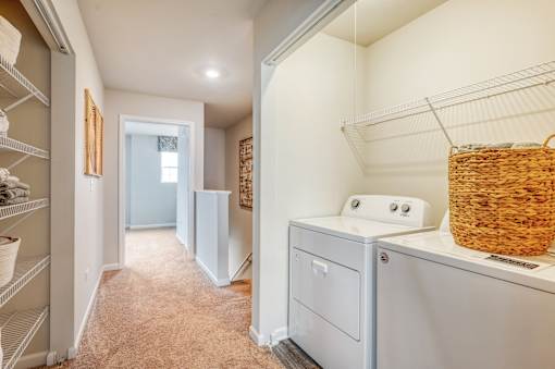 A laundry room with a washer and dryer.
