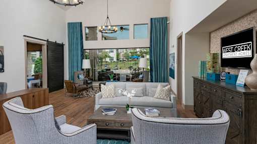 A living room with a grey sofa and a coffee table.