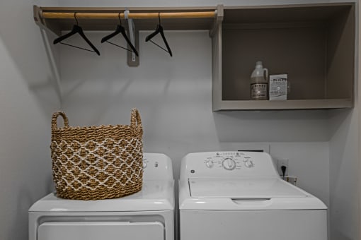 a laundry room with a washer and dryer