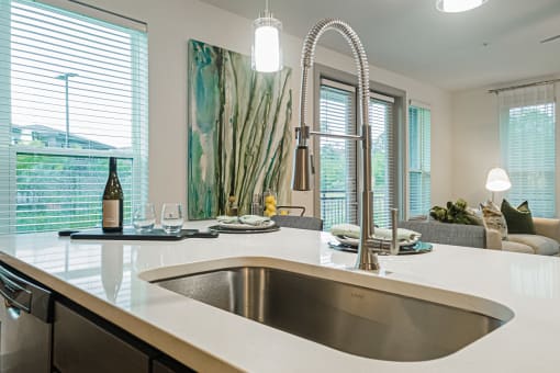 a kitchen with a sink and a window