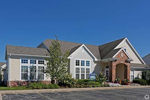 A large house with a brick pillar entrance.