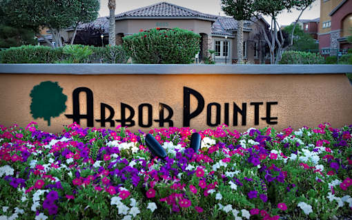 A sign that says Orbor Pointe in front of a building.