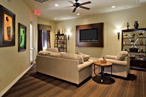 a living room with couches and a tv