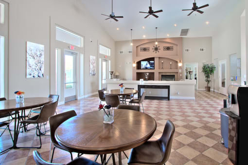 a large living room with a dining room table and a kitchen