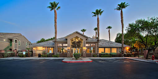 A building with a palm tree in front of it.