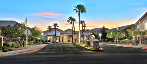 a street in front of a house with palm trees
