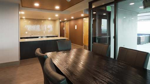 A conference room with a long table and chairs at Denver Metro Village Apartments, Denver, 80204