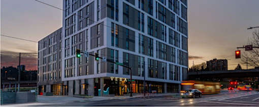 A modern building with a lot of windows is shown.