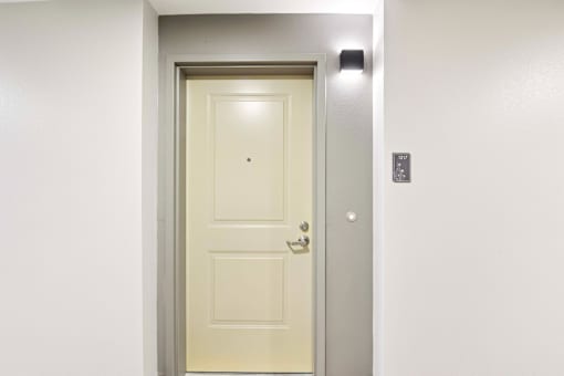 A white door with a silver frame is closed.
