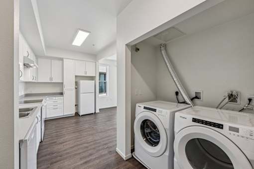 A laundry room with a washer and dryer.