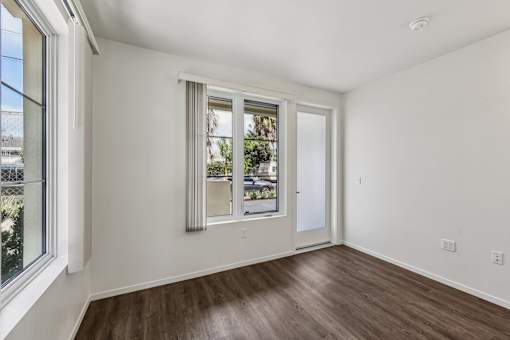 A room with a window and a door is shown.